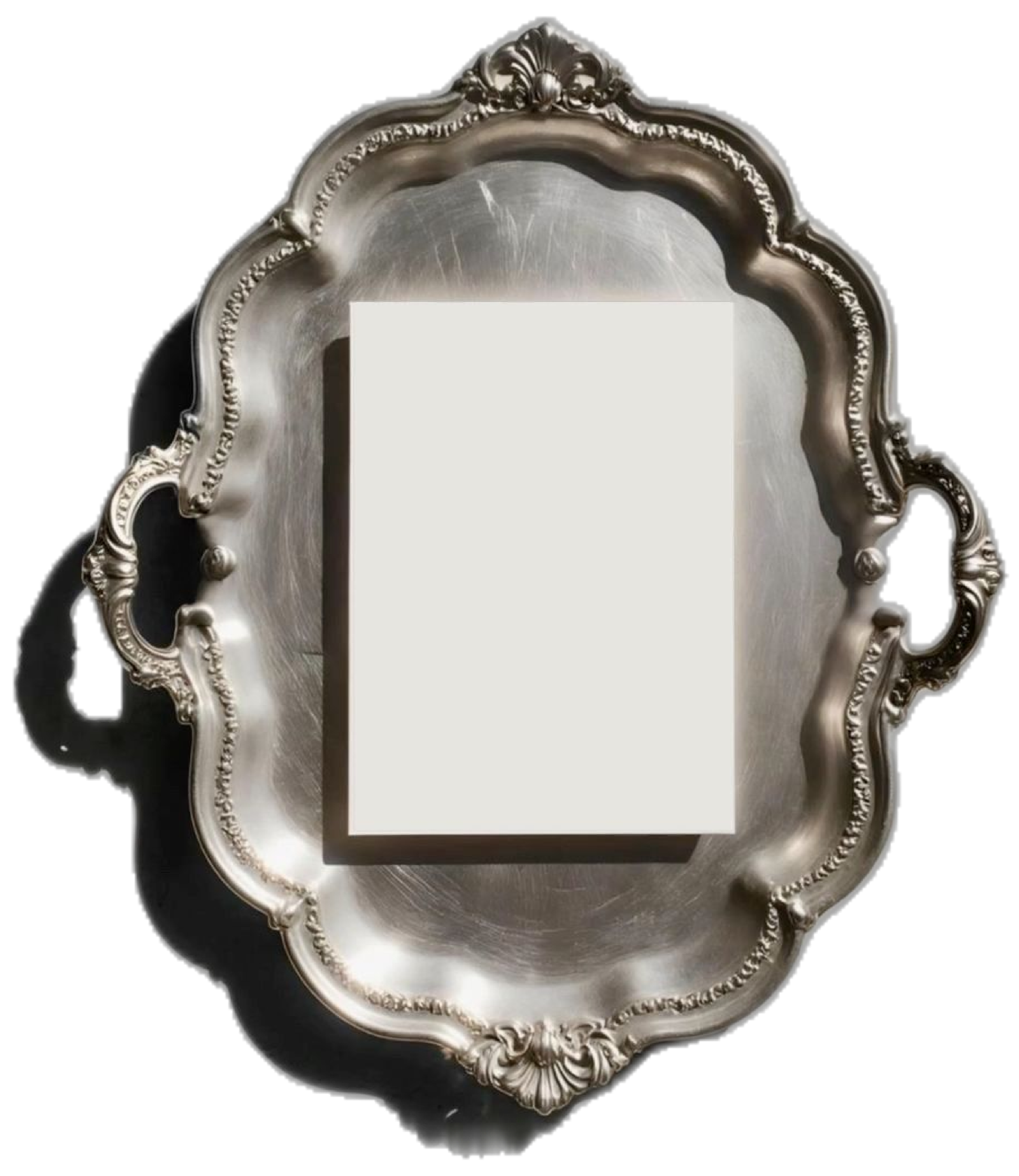 Ornate silver serving plate with a paper event card placed at the center